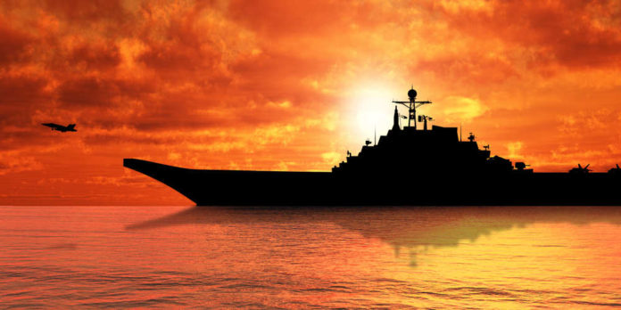 Aircraft,Carrier,On,Sea,Near,Iraq,Over,Sunset