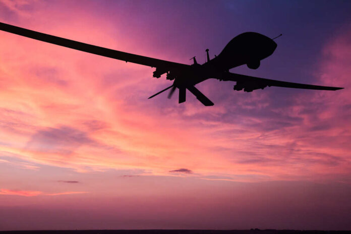 Military,Drone,Silhouette,On,Sunset,Background.